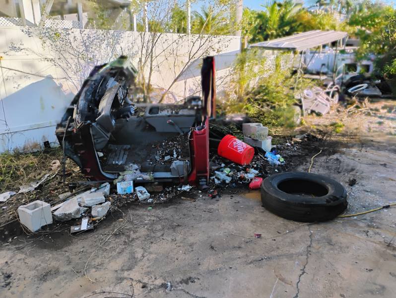 Abandoned burned car before removal